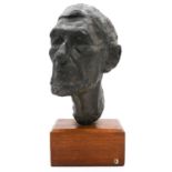 A sculpted bronze head of an elderly gentleman. Mounted on a wooden stand. Unsigned. H.45cm