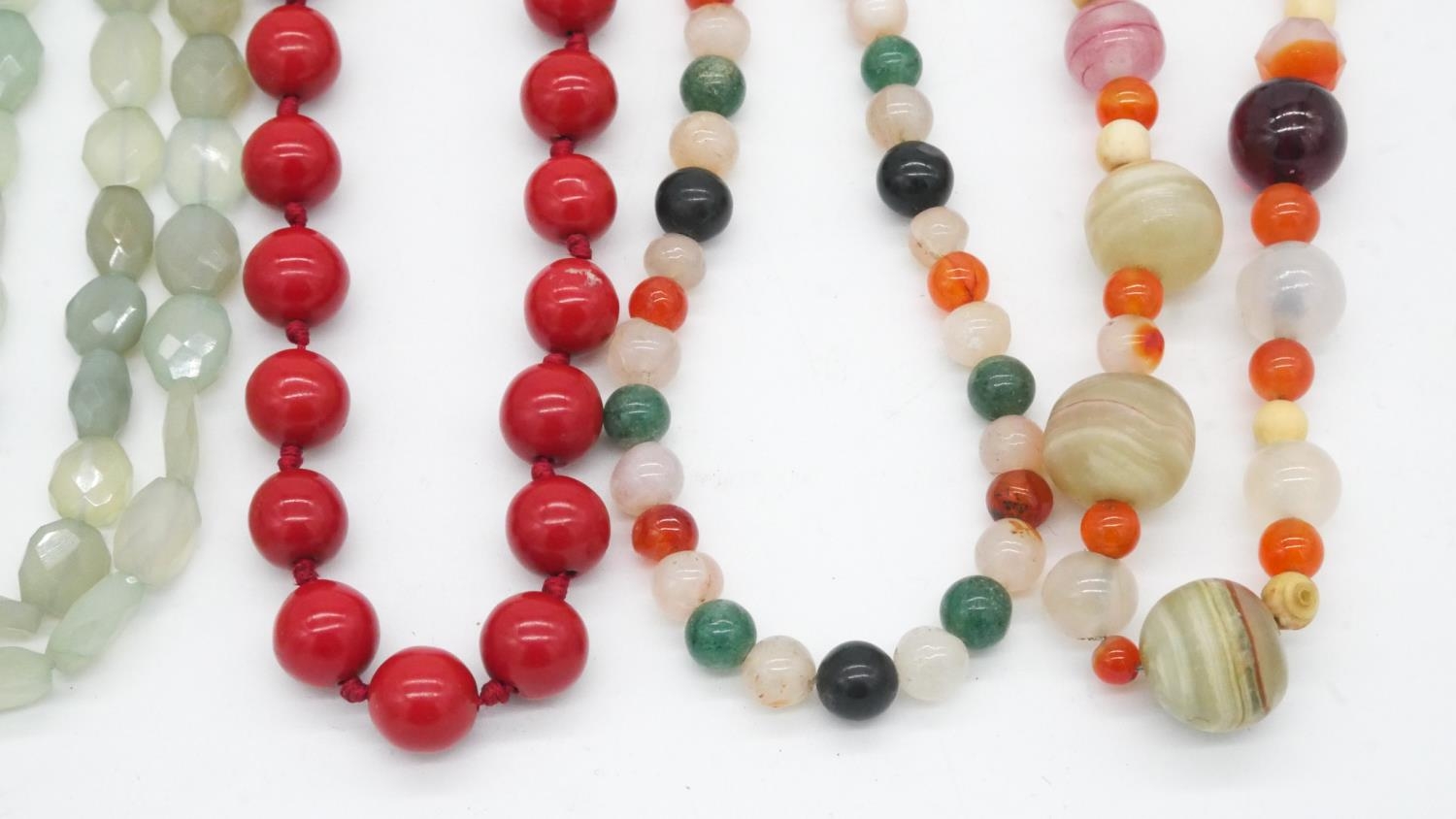 A collection of six gemstone and lacquer necklaces. Including a double stranded faceted green - Image 3 of 4