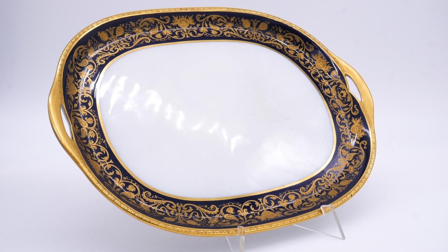 Two Minton porcelain royal blue and gilt stylised foliate design serving platters along with a - Image 6 of 9