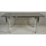 A vintage dining table with smoked plate glass top on chromium base. H.76 L.170 D.90cm