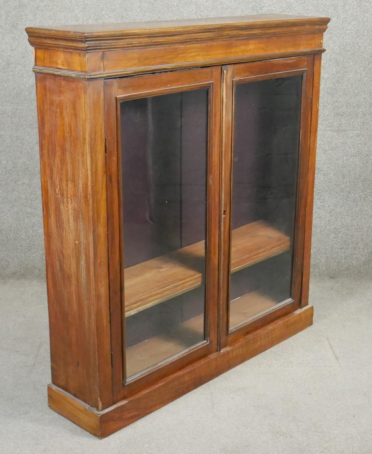 A late 19th century walnut glazed bookcase on plinth base. H.110 W.103 D.24cm - Image 2 of 3