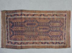 A Belouch rug with repeating lozenge medallions on a sapphire ground. L.156 W.85cm