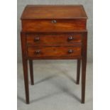 A Georgian mahogany desk the lift off slope with twin carrying handles above deep frieze drawer on