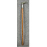 An antique silver plated walking cane with a dogs head finial and fern engraved white metal