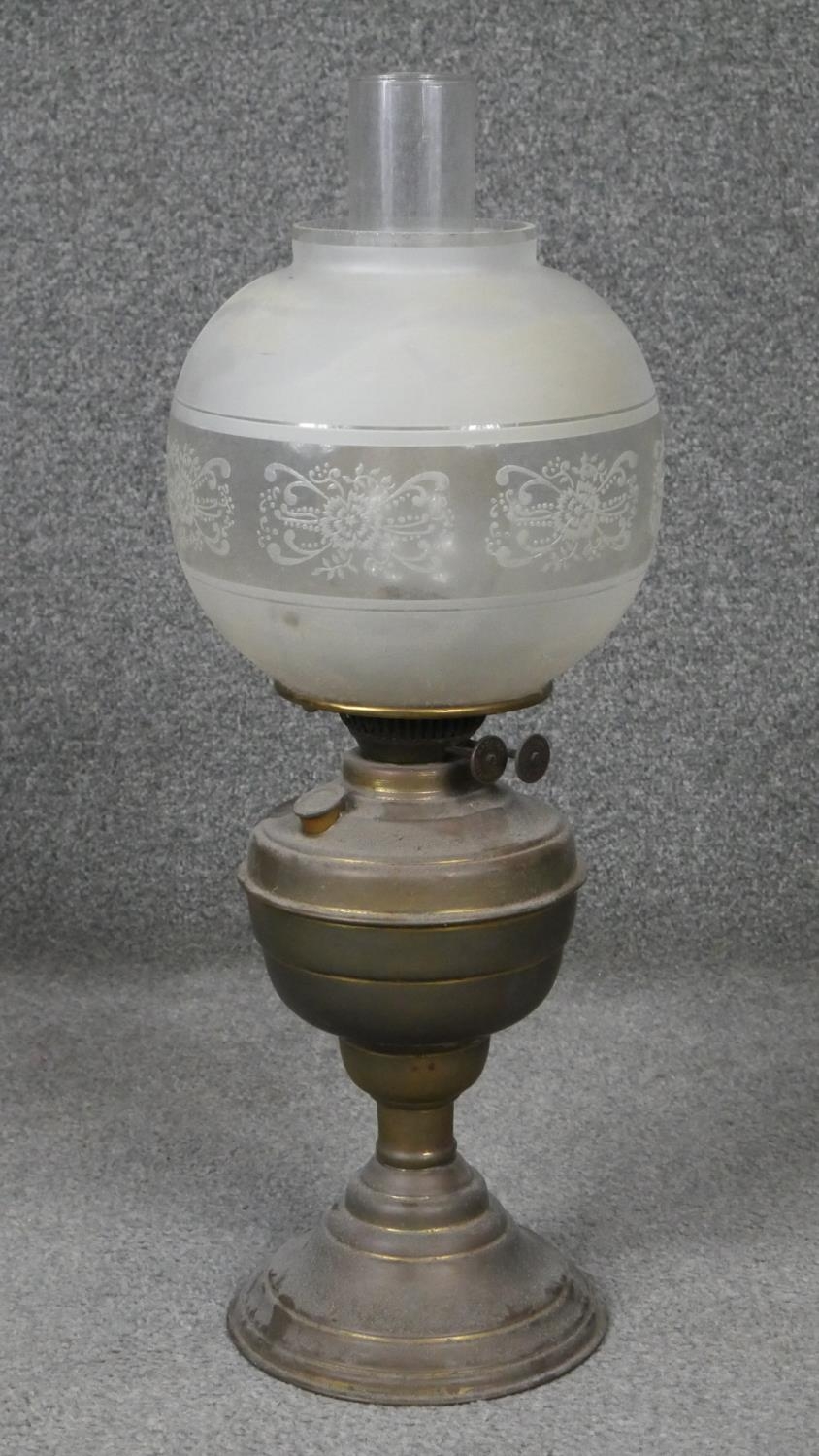 Four antique brass oil lamps one with an etched globe shade. H.54cm - Image 2 of 6