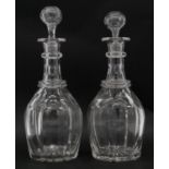 A pair of Victorian cut crystal decanters with original stoppers and star cut bases. H.29cm