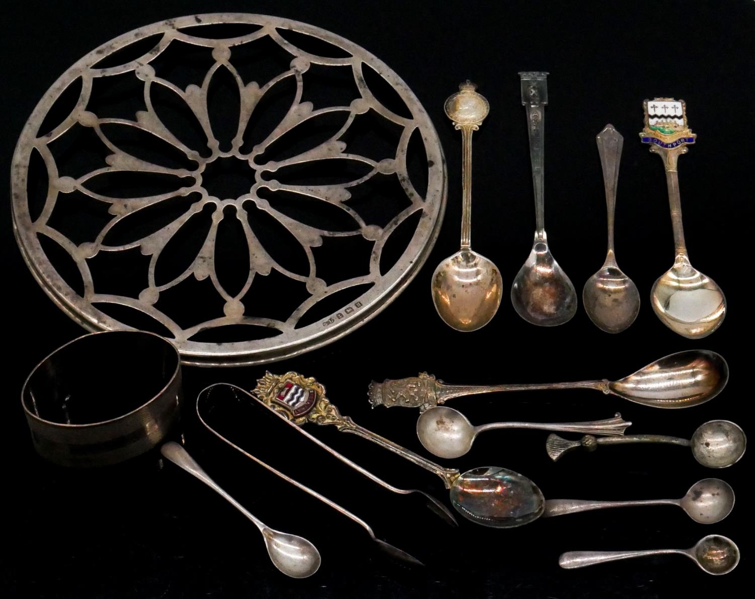A collection of silver and silver plated teaspoons and other silver items. Including a pierced