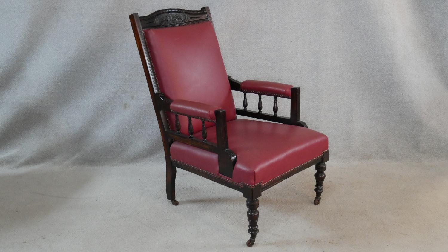 A Victorian carved frame armchair in faux leather upholstery on turned tapering supports. H.98cm - Image 2 of 6