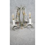 A green painted scrolling design four branch chandelier with clear and amber glass drops. D.34cm