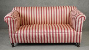 A 19th century sofa in striped reupholstery on turned mahogany supports. H.86 L.178 D.82cm