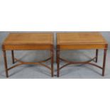 A pair of mahogany and crossbanded 19th century style side tables on fluted tapering supports united