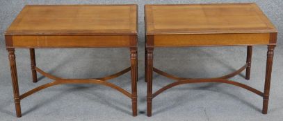 A pair of mahogany and crossbanded 19th century style side tables on fluted tapering supports united