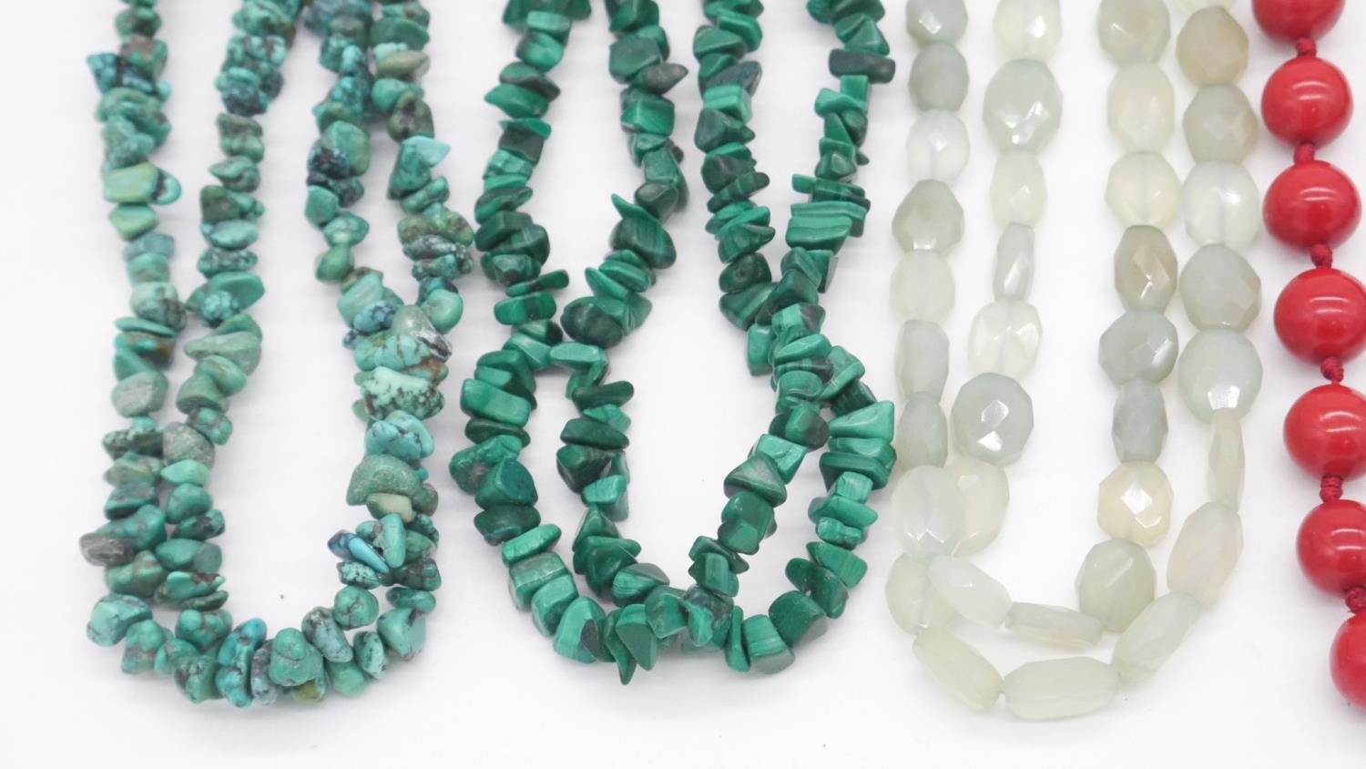 A collection of six gemstone and lacquer necklaces. Including a double stranded faceted green - Image 2 of 4