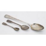 A collection of sterling silver spoons. Including a Georgian silver basting spoon hallmarked SBIB