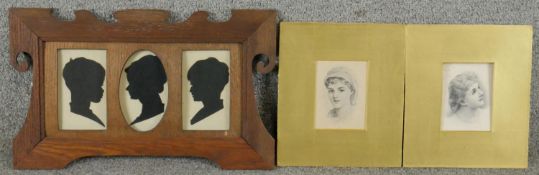 An Art Nouveau oak frame with three silhouette paper cut outs of children along with two lithographs