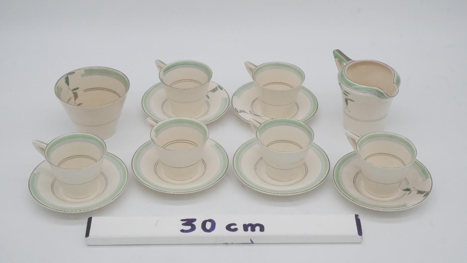 A six person Soho pottery Solian ware green floral pattern coffee set. Maker's mark to the base. - Image 9 of 9