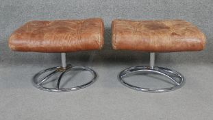 A pair of vintage Ekornes footstools in buttoned leather upholstery on chrome bases. H.36 W.56 D.