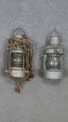 Two vintage ship's masthead brand oil lanterns.