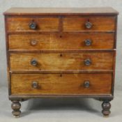 A 19th century mahogany chest of drawers on turned supports. H.103 W.102 D.52cm