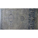 An old Eastern carpet. (With general wear, as photographed). L.320 W.267cm