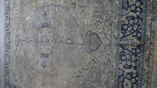 An old Eastern carpet. (With general wear, as photographed). L.320 W.267cm