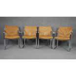 In the manner of Preben Fabricius, a set of four vintage leather upholstered dining chairs on