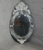 A vintage Venetian mirror in floral etched glass frame. H.85 W.48