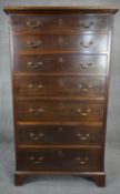 A Georgian style mahogany semainier chest of drawers on bracket feet. H.144 W.82 D.42cm