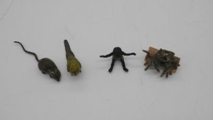 Four cold painted miniature Austrian bronzes. Including a green budgerigar, two grey striped cats on