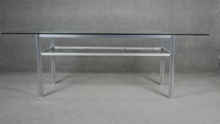 A metal framed dining table with Euro Tuff plate glass top. H73 W194 D117