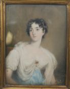 A gilt metal repousse framed and glazed 19th century portrait minitaure on ivory of a lady in a blue