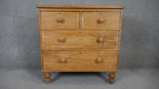 A Victorian pine bedroom chest on turned supports. H.80 W.80 D.45cm