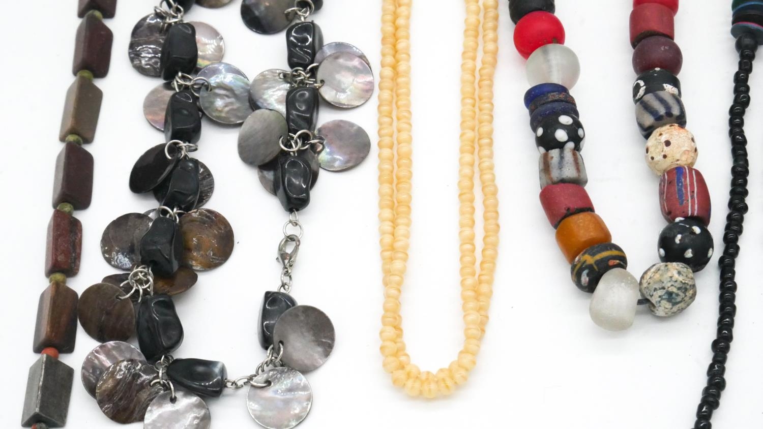 A collection of costume jewellery. Inluding a tribal cane glass bead necklace and other necklaces. - Image 3 of 6