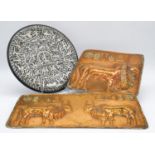 A collection of metal ware. Including two hammered copper repousse plaques, replicas of the Indus