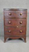 A Regency mahogany narrow bow fronted chest on swept supports. H.93 W.62 D.46cm