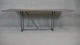 An industrial style metal topped low table. H.60 W.87 D.54cm