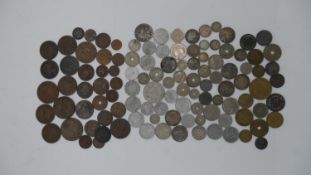 A large collection of British and world coins and medals. Including some silver and a George and
