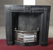 A Regency style heavy cast iron fire place insert with lion mask decoration and fluted pilasters