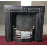 A Regency style heavy cast iron fire place insert with lion mask decoration and fluted pilasters