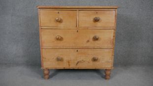 A Victorian pine bedroom chest on turned supports. H.80 W.80 D.43cm