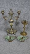 A brass and porcelain twin branch candelabra, a pair of brass chambersticks and a Gothic brass