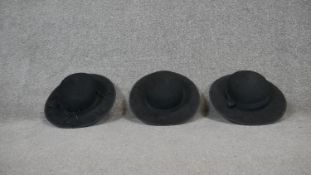 Three felt wide brimmed hats.