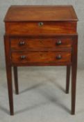 A Georgian mahogany desk the lift off slope with twin carrying handles above deep frieze drawer on