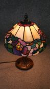 A Tiffany style leaded and coloured glass table lamp.