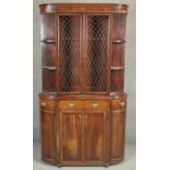 A 19th century style mahogany two section library bookcase of bowed outline. H.183 W.100 D.26cm