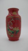 A Chinese polychrome glazed baluster vase with relief lotus and Chinese duck decoration and gilt