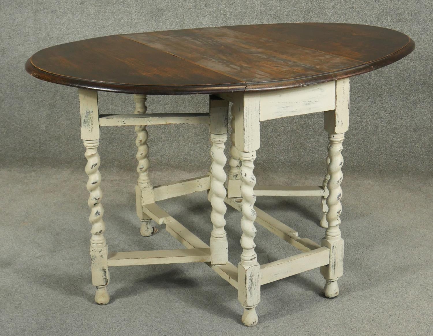 A mid century oak drop flap dining table on distressed painted gateleg barleytwist supports. H.72 - Image 2 of 5