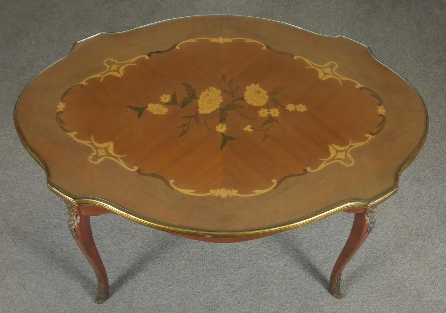 An Italian walnut and floral inlaid occasional table with shaped glass top on ormolu mounted - Image 3 of 5