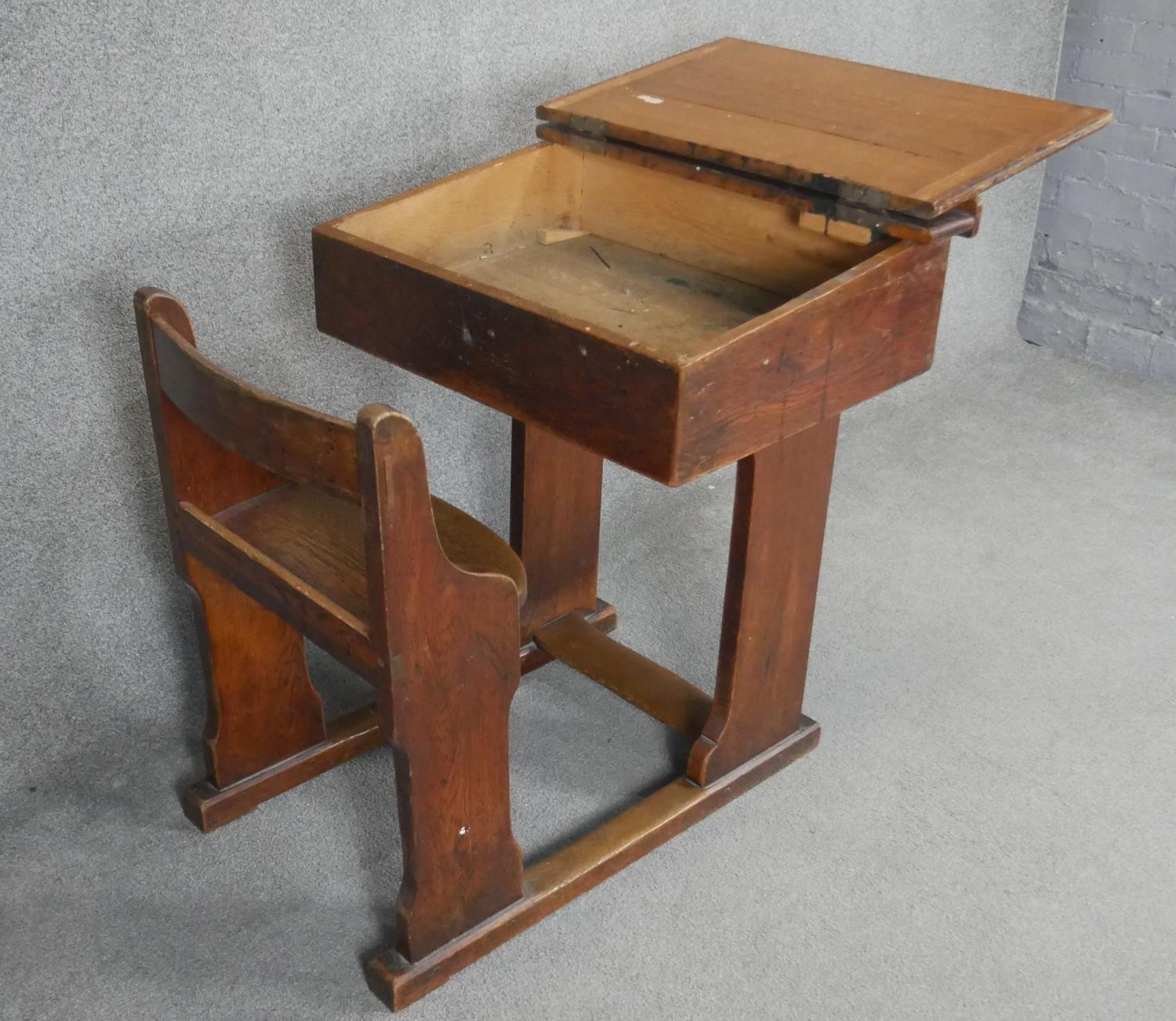 A vintage oak school desk with integral bench seat. H.88 W.90 D.69cm - Image 3 of 4