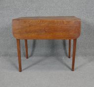 A 19th century mahogany drop flap Pembroke table on square tapering supports. H.65 W.76 D.47